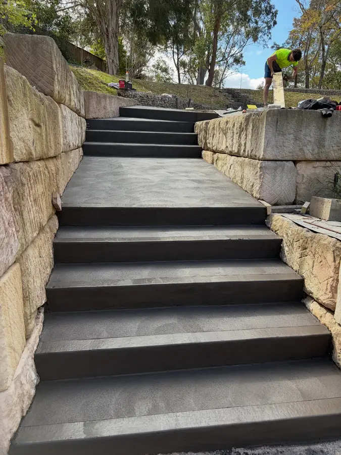 Charcoal steps between sandstone block walls