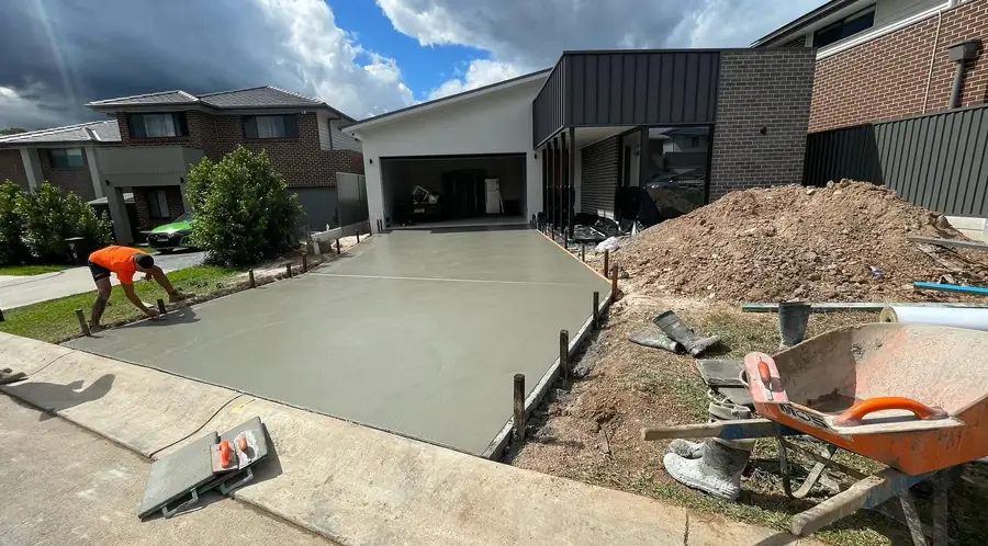 Crew finishing wide driveway