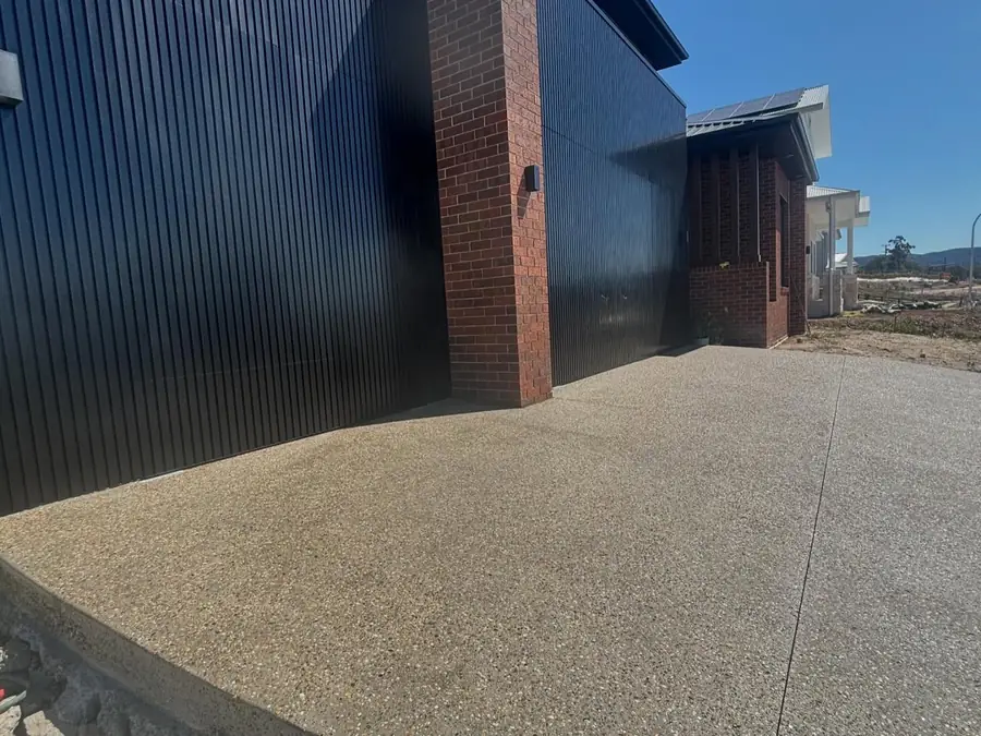 Exposed driveway black house