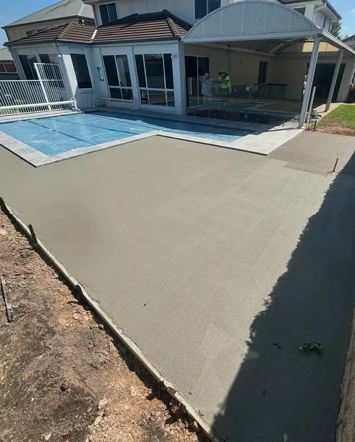 Pool surround poured right up to the coping